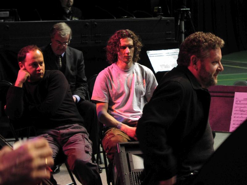 Lionel Hampton Jazz Festival, February, 2005. Doc Skinner and Russian drummers Eduard Zizak and Alex Zinger watch drummer Jeff Hamilton rehearse on the Kibbie Dome Stadium scene during daytime soundcheck (Cyril Moshkow, Jazz.Ru Magazine)